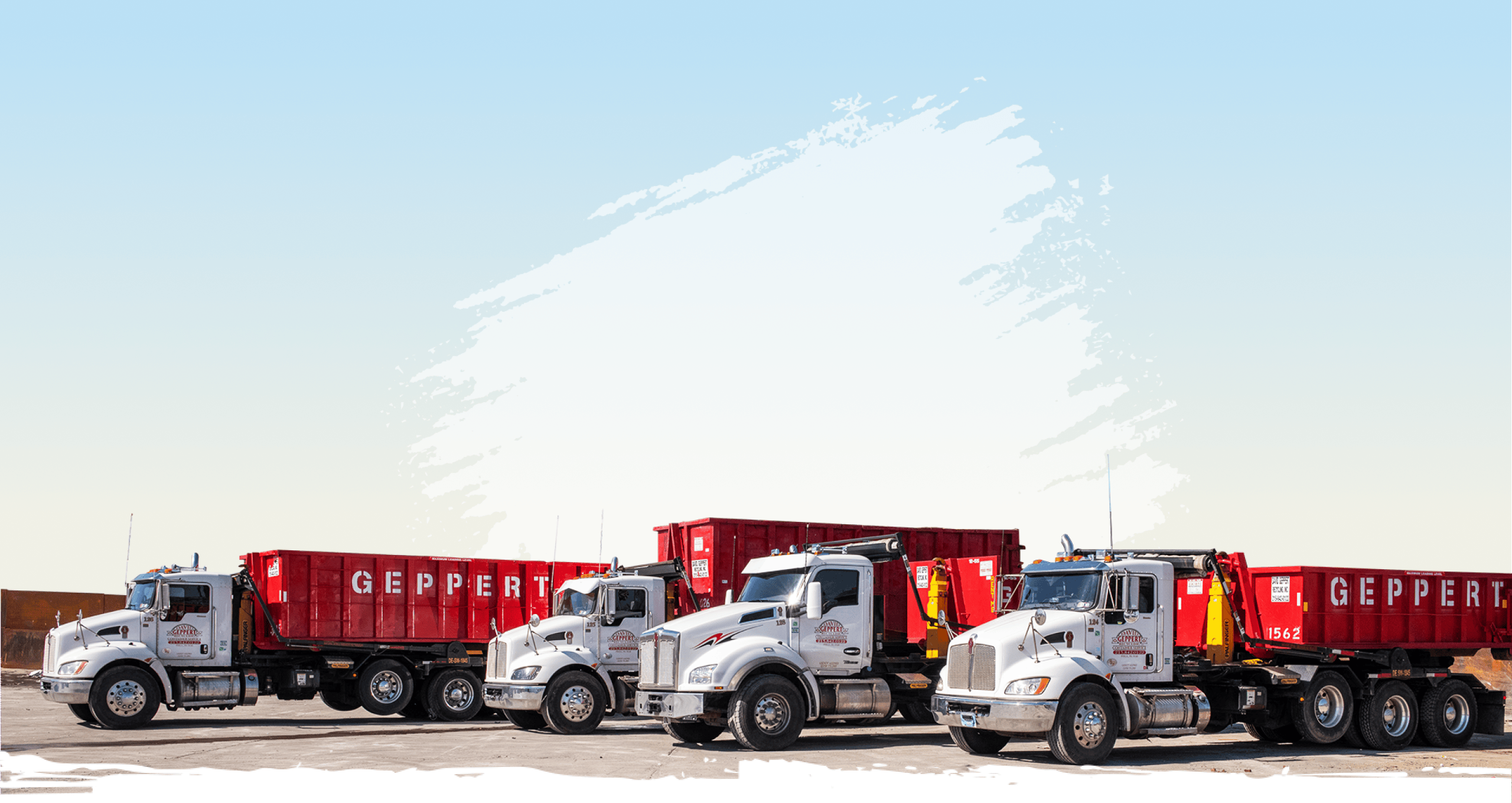 Truck unloading a dumpster